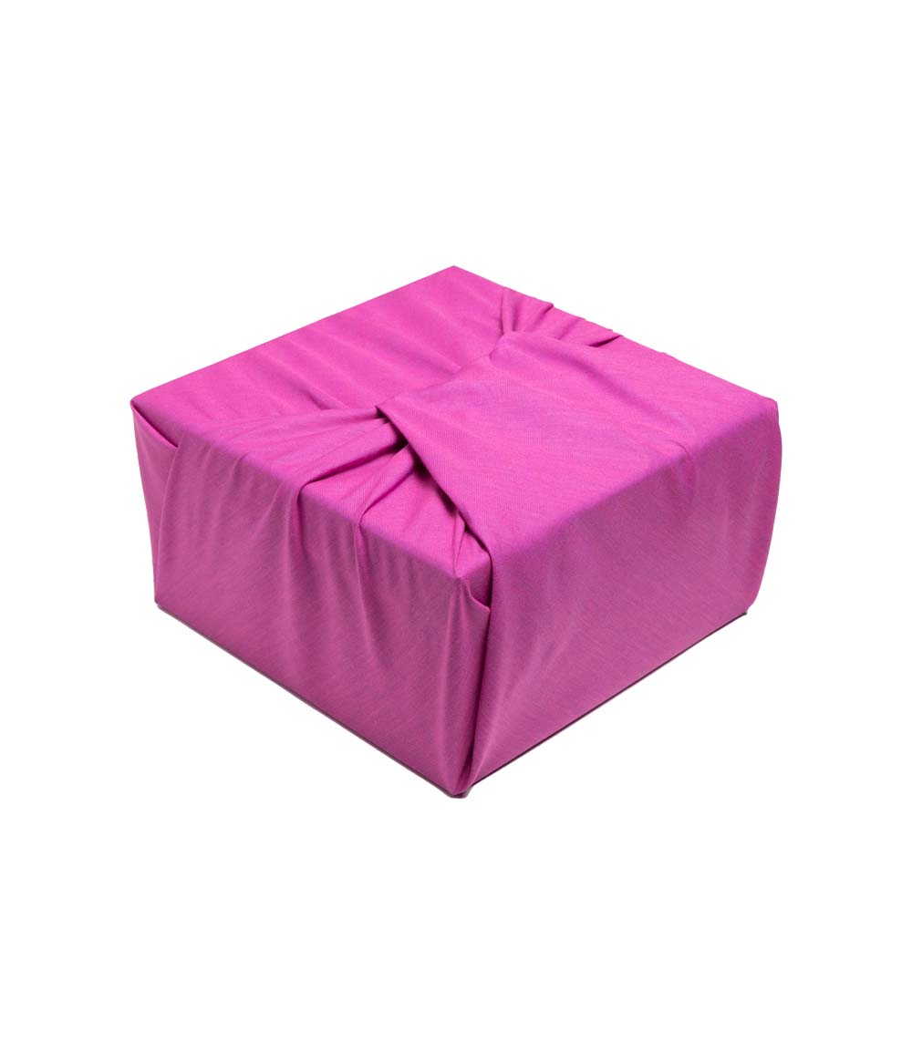 Fuchsia fabric gift wrapped box at an angle
