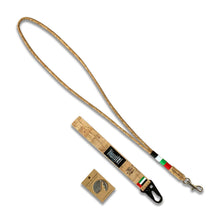 Load image into Gallery viewer, image of the 3 National Day gift set items; 1 metal magnet with the UAE map silhouette, cork wrist strap keychain and a cork lanyard wrapped in thread of red, white, green and black. 
